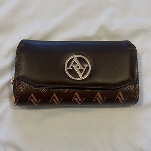 Dark brown double zipper wallet and a pocket in the front